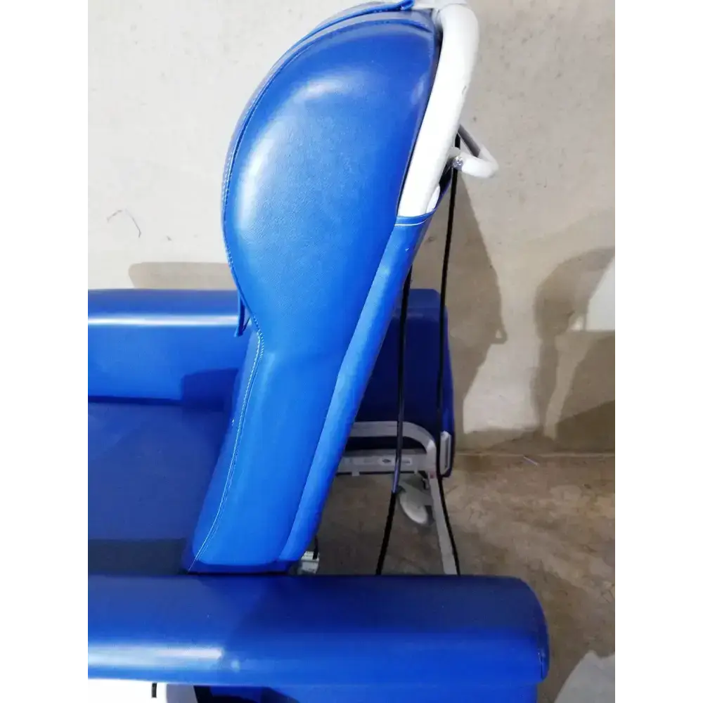 Blue padded care recliner dialysis chair with white plastic frame and adjustable armrests for medical use