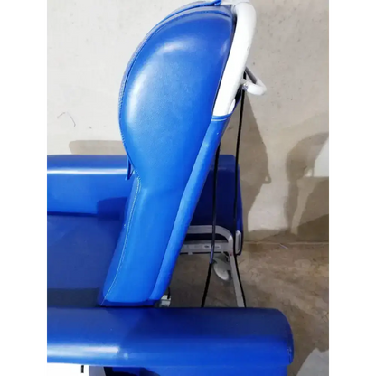 Blue padded care recliner dialysis chair with white plastic frame and adjustable armrests for medical use