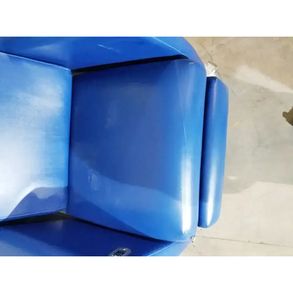 Blue vinyl-covered winco 694 care recliner dialysis chair with padded armrests back massager and side trays