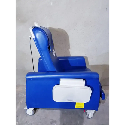 Blue Winco 694 care recliner dialysis chair with white accents, casters, back massager, and side trays for patient comfort