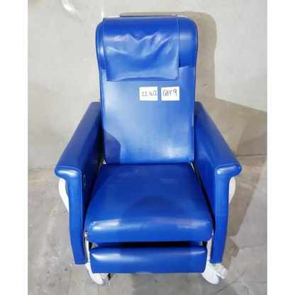 Blue vinyl winco 694 care recliner dialysis chair with white caster wheels back massager and side trays