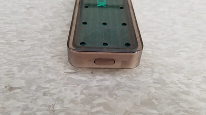 Back view of rose gold xomed poly vac medical tool sterilization case with dark green panel for reuse medical equipment