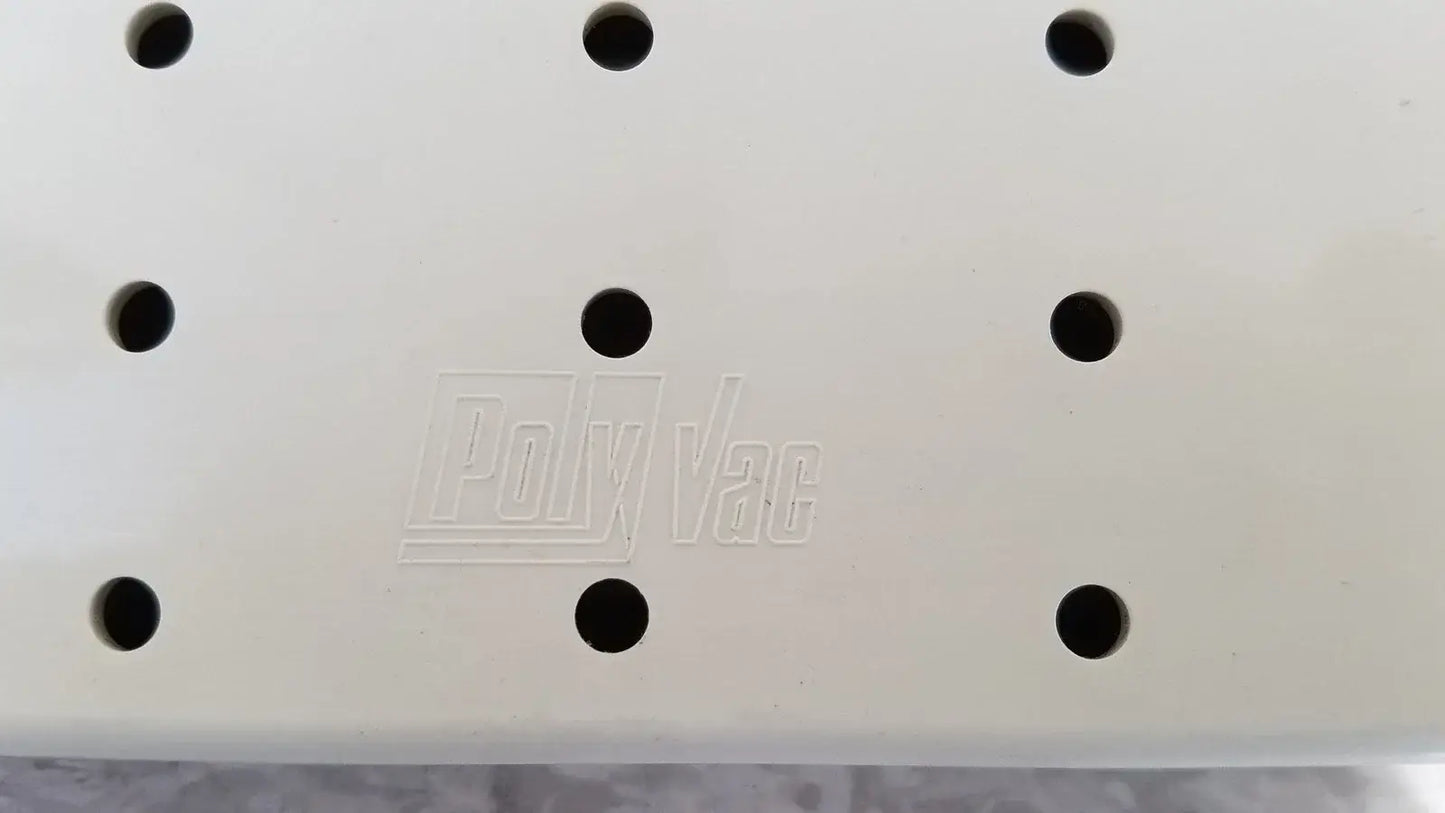 White plastic panel with black circular holes and embossed polyvac logo for xomed poly vac medical equipment sterilization case