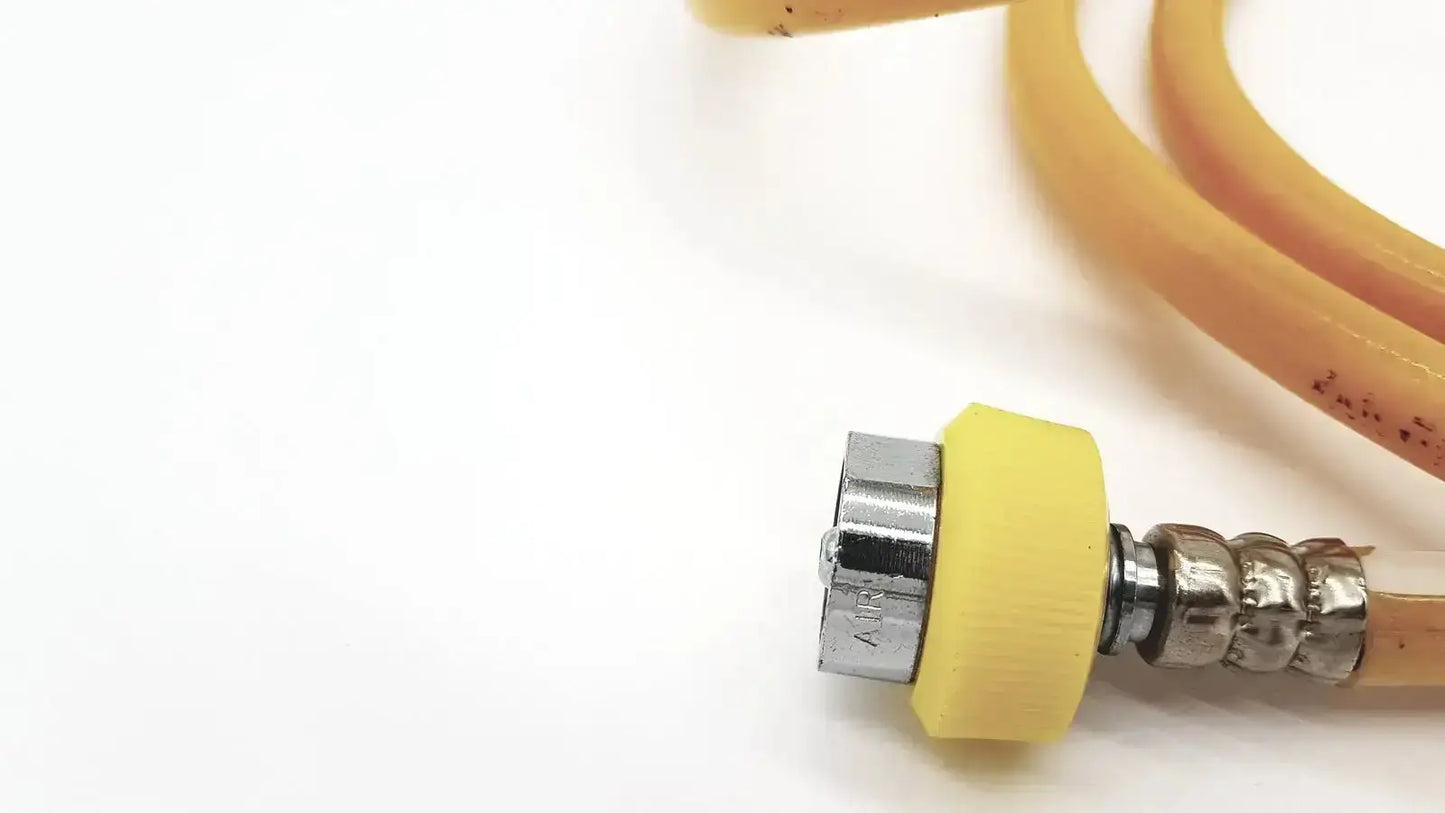 Yellow rubber-coated hose air with metallic threaded connector from air print lot 08-12 for industrial use