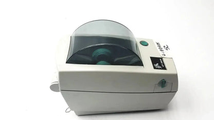 White zebra lp2824 thermal label printer with transparent protective cover and green control button accents untested