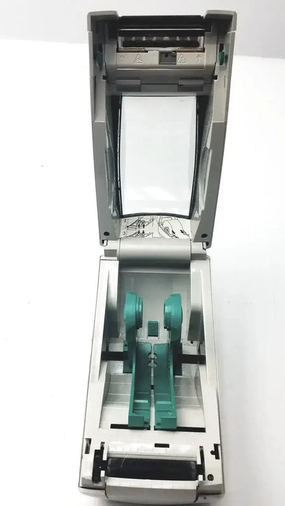 Gray zebra lp2824 thermal label printer showing teal internal components and paper roll compartment untested model