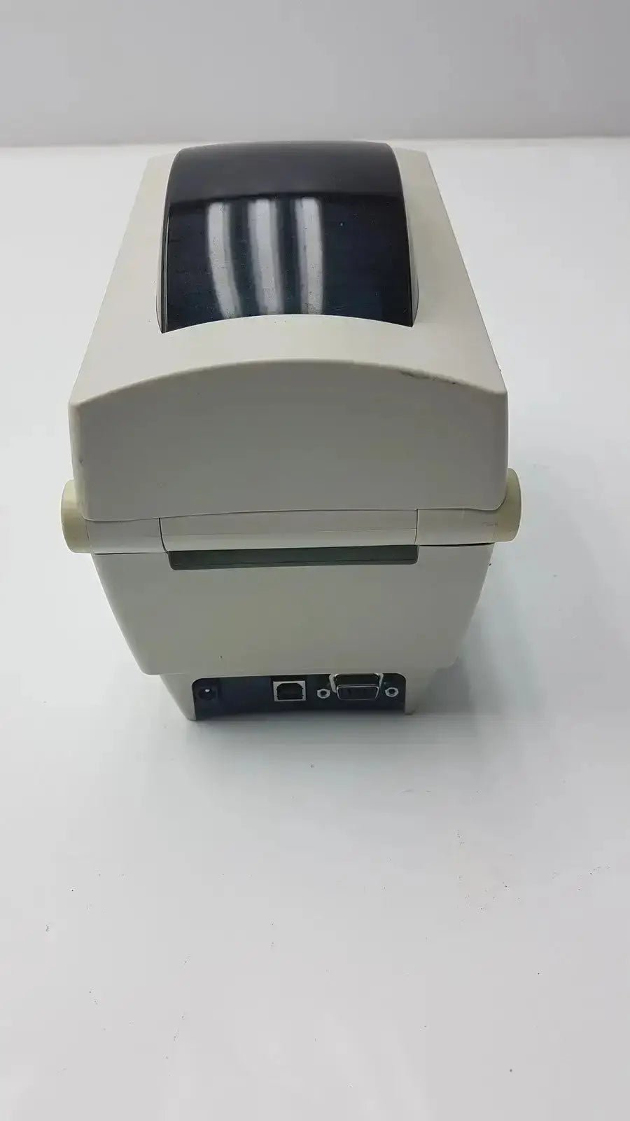 Beige zebra tlp 2824 plus thermal printer rear view with black top cover and visible ports for connectivity