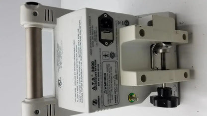 Gray plastic zimmer hall ats 3000 automatic tourniquet system showing the side view of the medical device