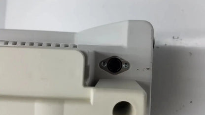 Off-white plastic housing with black circular port secured by screws on back side of zimmer hall ats 3000 automatic tourniquet