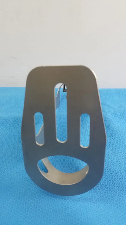 Black metal bracket with three vertical slots and circular base for biomet finneli tensioning reuse medical equipment