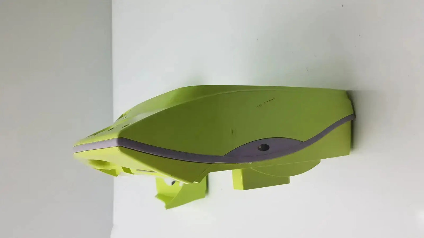 A lime green plastic model of the futuristic front section of the zoll aed plus defibrillator with gray accents