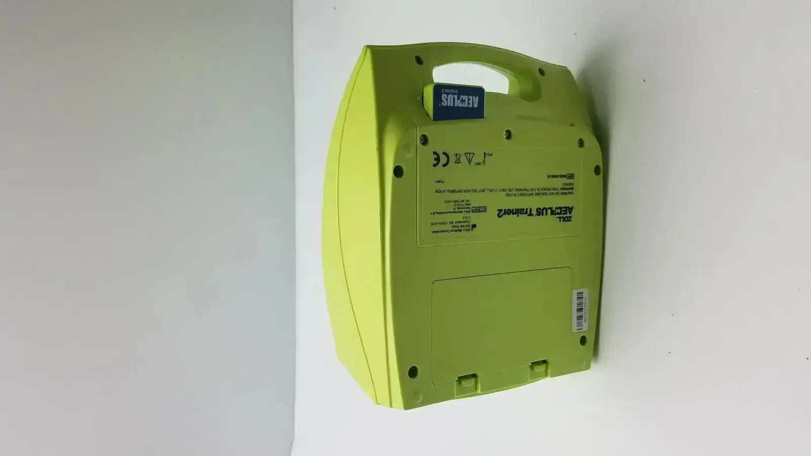 Lime green plastic zoll aed plus trainer case with blue label and handle for easy portability model 8008-0050-01