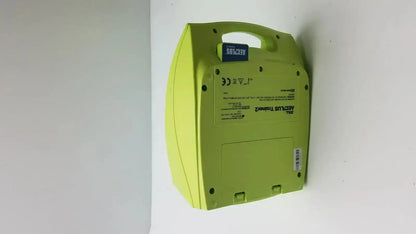 Lime green plastic zoll aed plus trainer case with blue label and handle for easy portability model 8008-0050-01