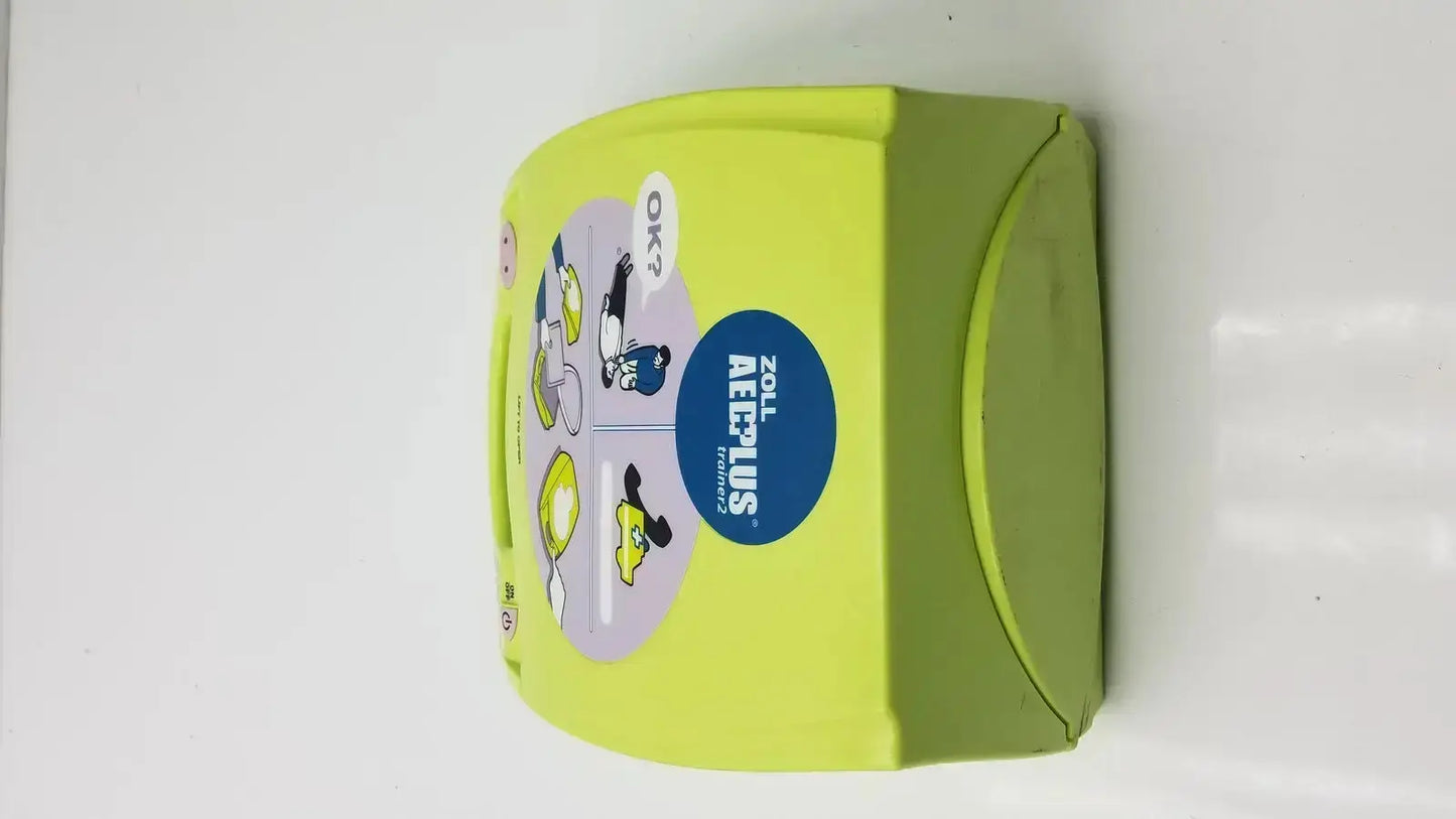 Lime green zoll aed plus trainer 2 automated external defibrillator box with cartoon illustrations and blue logo