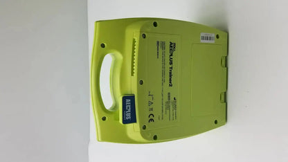 Lime green plastic zoll aed plus trainer 2 defibrillator case with molded handle and labeled specifications ref 8008-0050-01